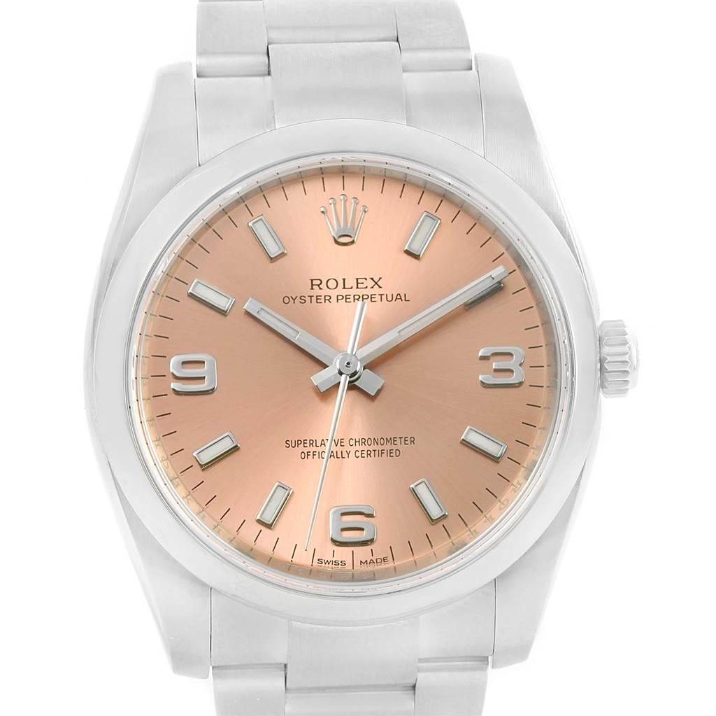 The image shows a frontal view of a Rolex Air-King 114200 Men's Stainless Steel Pink Dial 114200 Men's Stainless Steel Pink Dial watch with a gold dial and silver indices and hands.