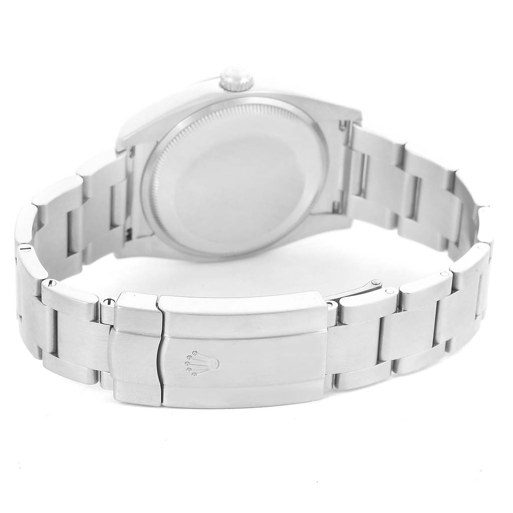 The image shows the back view of a Rolex Air-King 114200 Men's Stainless Steel Pink Dial 114200 Men's Stainless Steel Pink Dial, highlighting the closed clasp and bracelet.