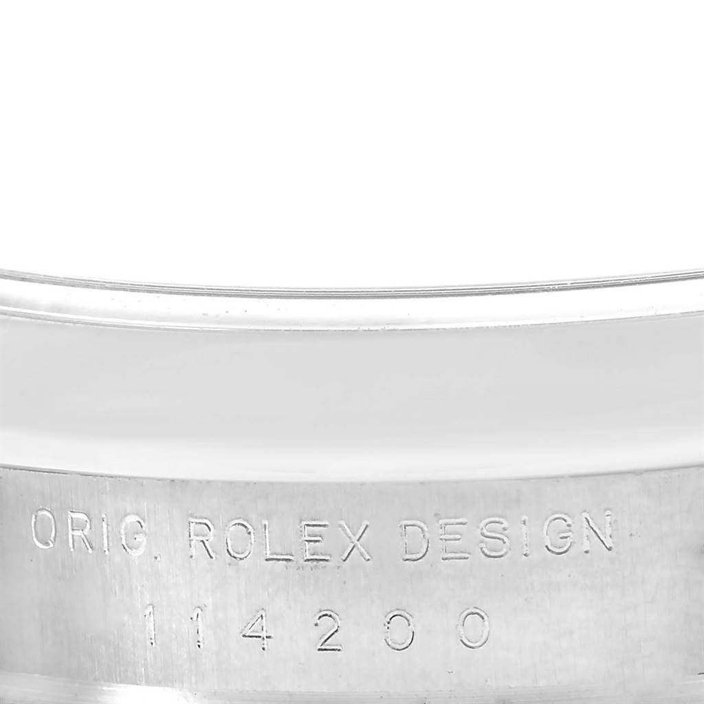 This image shows a close-up of the engraved case side of a Rolex Air-King 114200 Men's Stainless Steel Pink Dial 114200 Men's Stainless Steel Pink Dial watch, displaying the model number 114200.