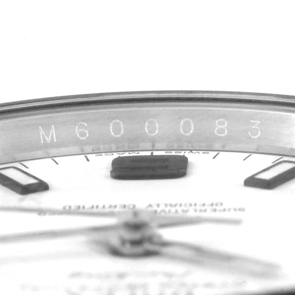 This image shows a close-up of the dial and inner bezel with serial number engraving on a Rolex Air-King 114200 Men's Stainless Steel White Dial 114200 Men's Stainless Steel White Dial watch.