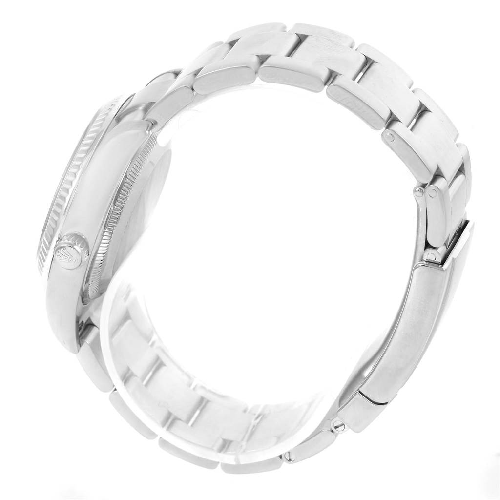 The image shows a Rolex Air-King 114234 Men's Stainless Steel Pink Dial 114234 Men's Stainless Steel Pink Dial watch viewed from the side, highlighting the bracelet and case, including the crown.