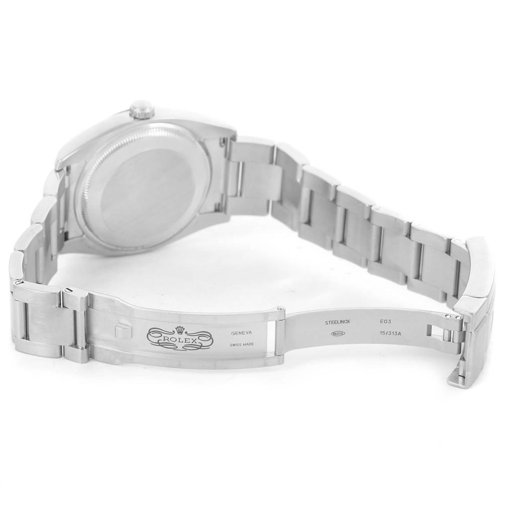 This image shows the underside of the Rolex Air-King 114234 Men's Stainless Steel Pink Dial 114234 Men's Stainless Steel Pink Dial watch, highlighting the case back and the opened clasp of the metal bracelet.