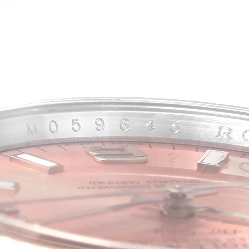This image shows a close-up of the serial number engraving on the edge of the Rolex Air-King 114234 Men's Stainless Steel Pink Dial 114234 Men's Stainless Steel Pink Dial watch face.