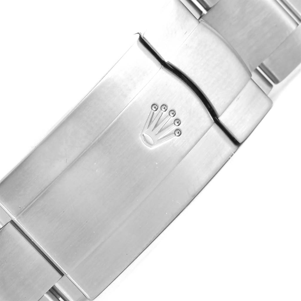 This image shows the clasp of a Rolex Air-King 114234 Men's Stainless Steel Pink Dial 114234 Men's Stainless Steel Pink Dial watch at a top-down angle.