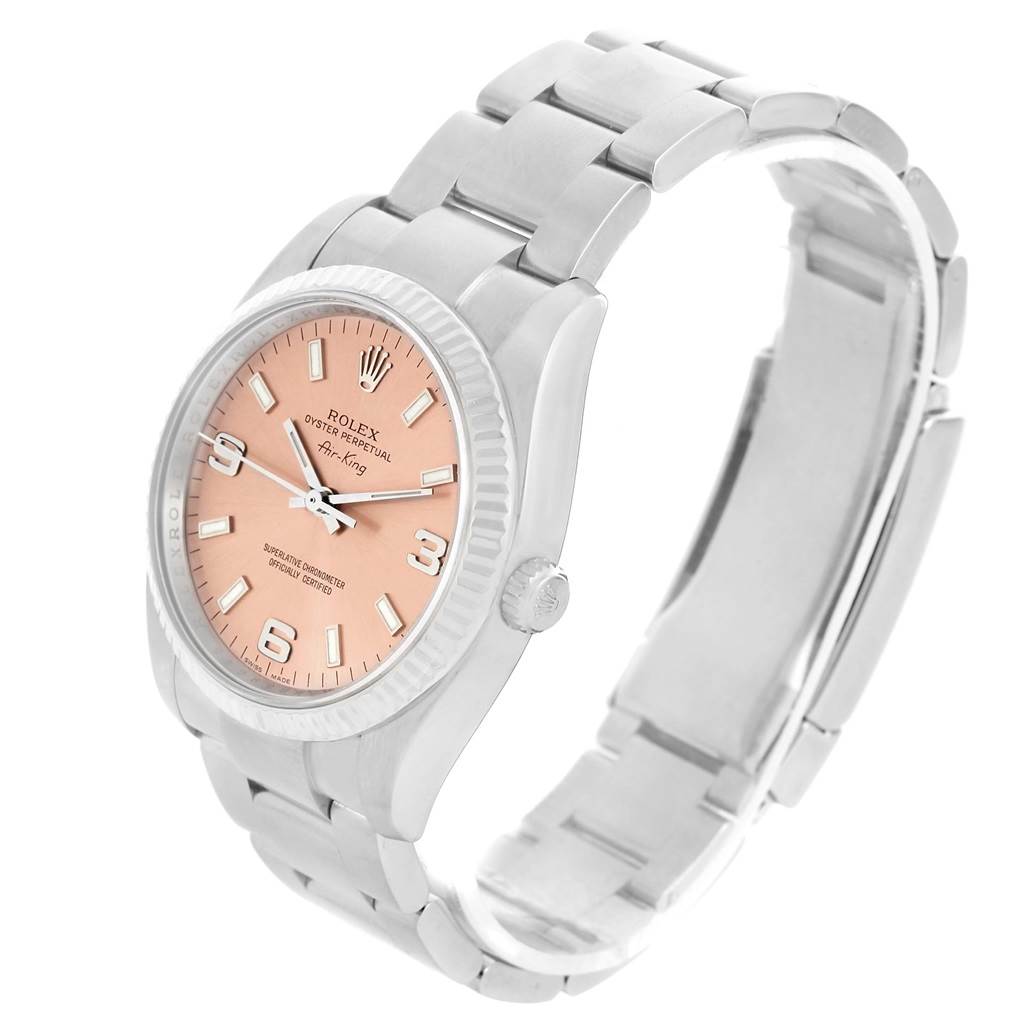 The image shows a Rolex Air-King 114234 Men's Stainless Steel Pink Dial 114234 Men's Stainless Steel Pink Dial watch from an angled side view, featuring its bracelet, case, and dial with a pink face.