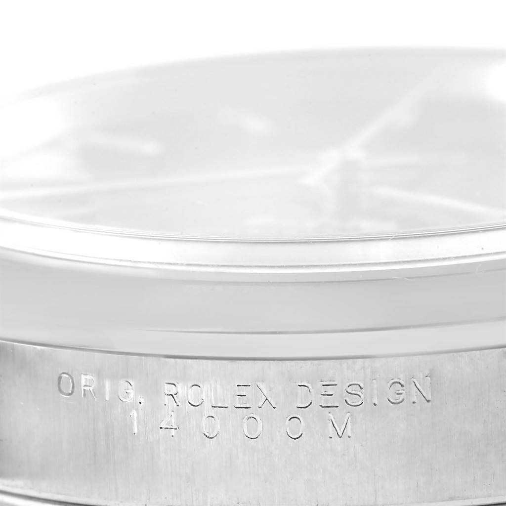 This close-up image shows the side of a Rolex Air-King 14000 Men's Stainless Steel Black Dial 14000 Men's Stainless Steel Black Dial watch, highlighting the engraved text on the case.