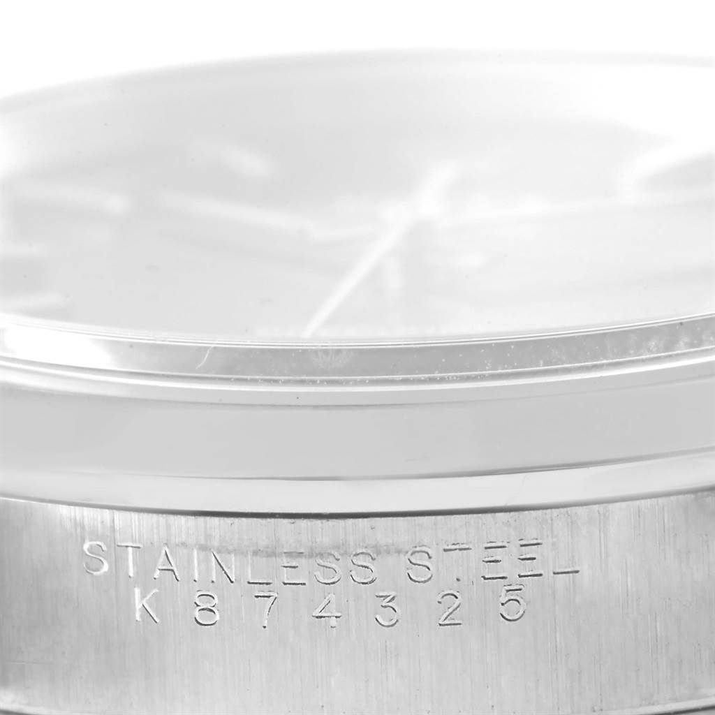 This image shows a close-up view of the Rolex Air-King 14000 Men's Stainless Steel Black Dial 14000 Men's Stainless Steel Black Dial stainless steel case with the serial number engraved.