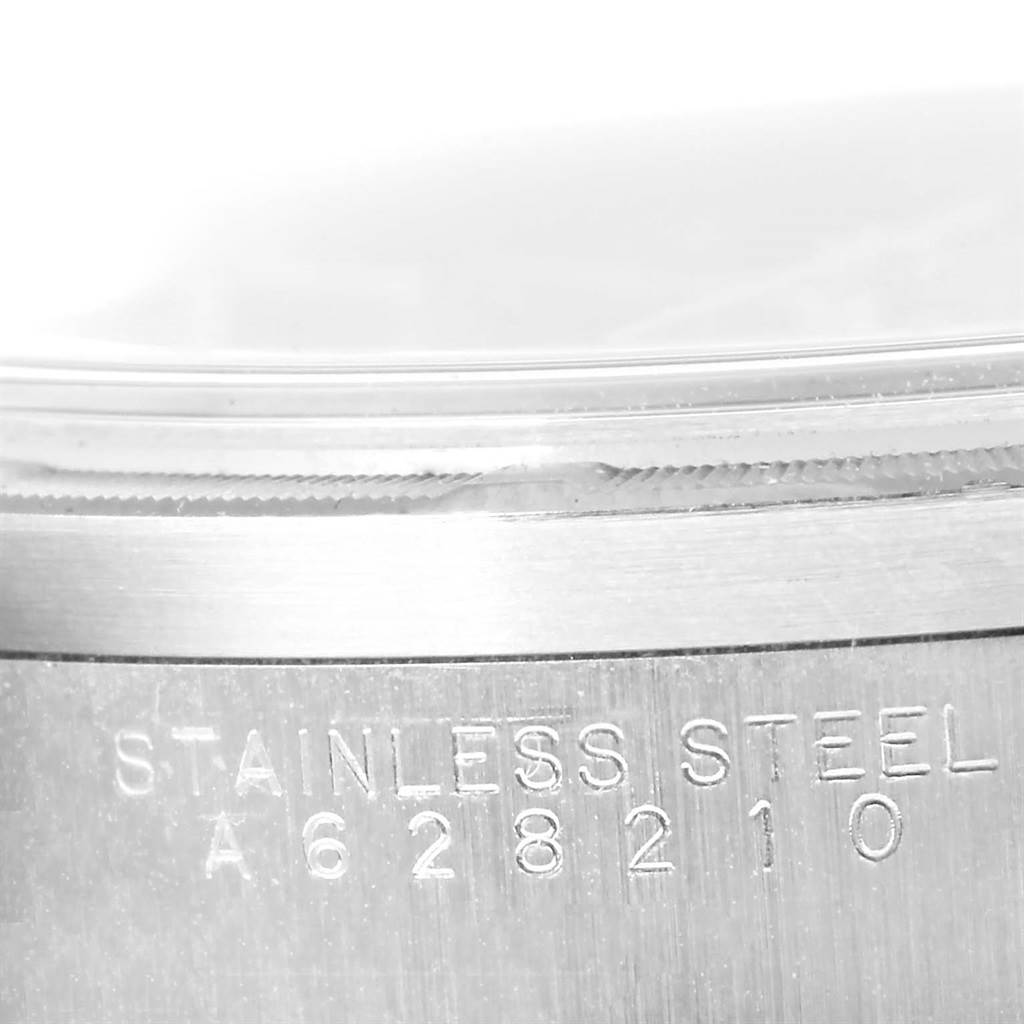 This image shows a close-up of the stainless steel case and serial number on a Rolex Air-King 14010 Men's Stainless Steel Blue Dial 14010 Men's Stainless Steel Blue Dial watch.