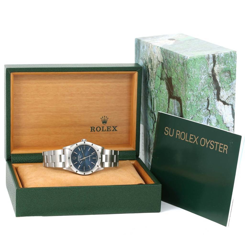 The image shows a Rolex Air-King 14010 Men's Stainless Steel Blue Dial 14010 Men's Stainless Steel Blue Dial watch in its open box with accompanying booklet and outer packaging.