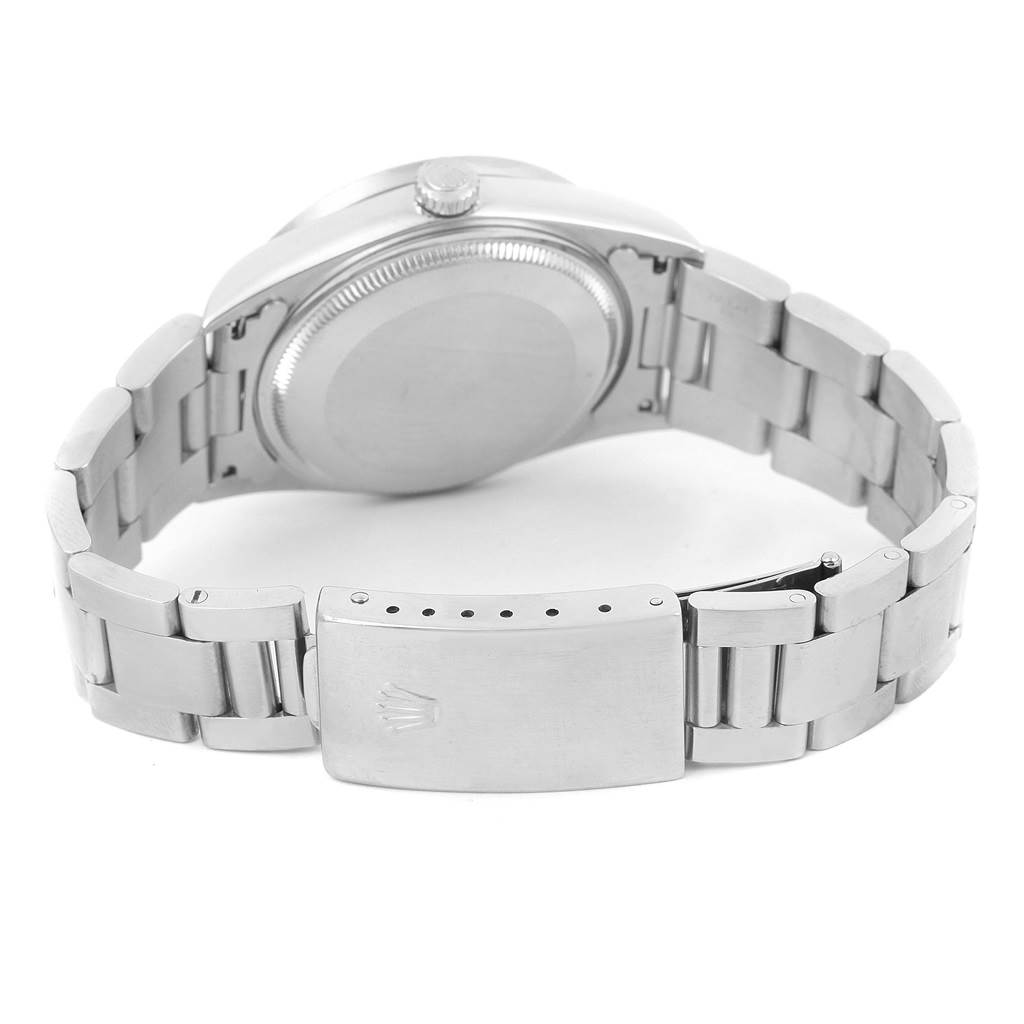 The image shows the Rolex Air-King 14010 Men's Stainless Steel Blue Dial 14010 Men's Stainless Steel Blue Dial watch from the back, highlighting the case back and metal bracelet.