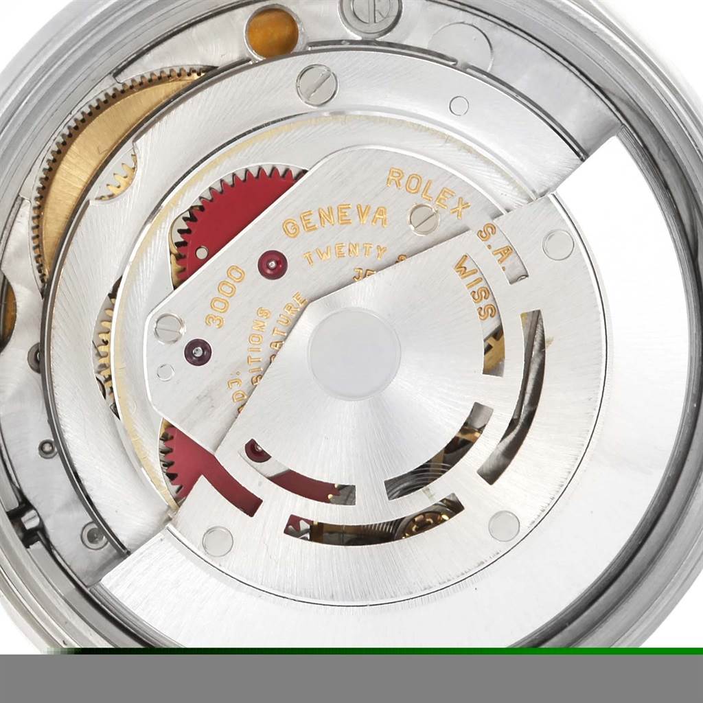 The image shows the internal movement mechanism of a Rolex Air-King 14010 Men's Stainless Steel Blue Dial 14010 Men's Stainless Steel Blue Dial watch, highlighting gears and inscriptions.