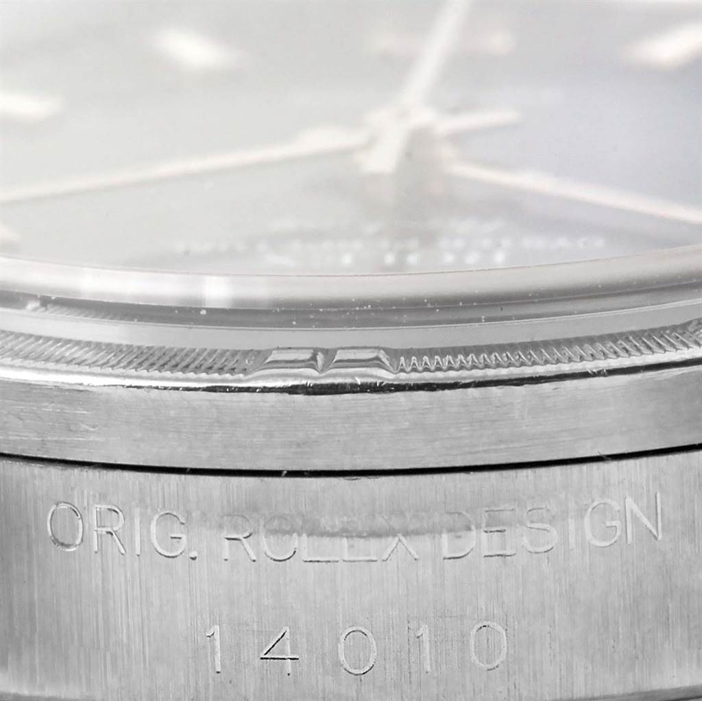 The image shows a close-up angle of the bezel and case of a Rolex Air-King 14010 Men's Stainless Steel Blue Dial 14010 Men's Stainless Steel Blue Dial watch, highlighting the "ORIG. ROLEX DESIGN 14010" engraving.