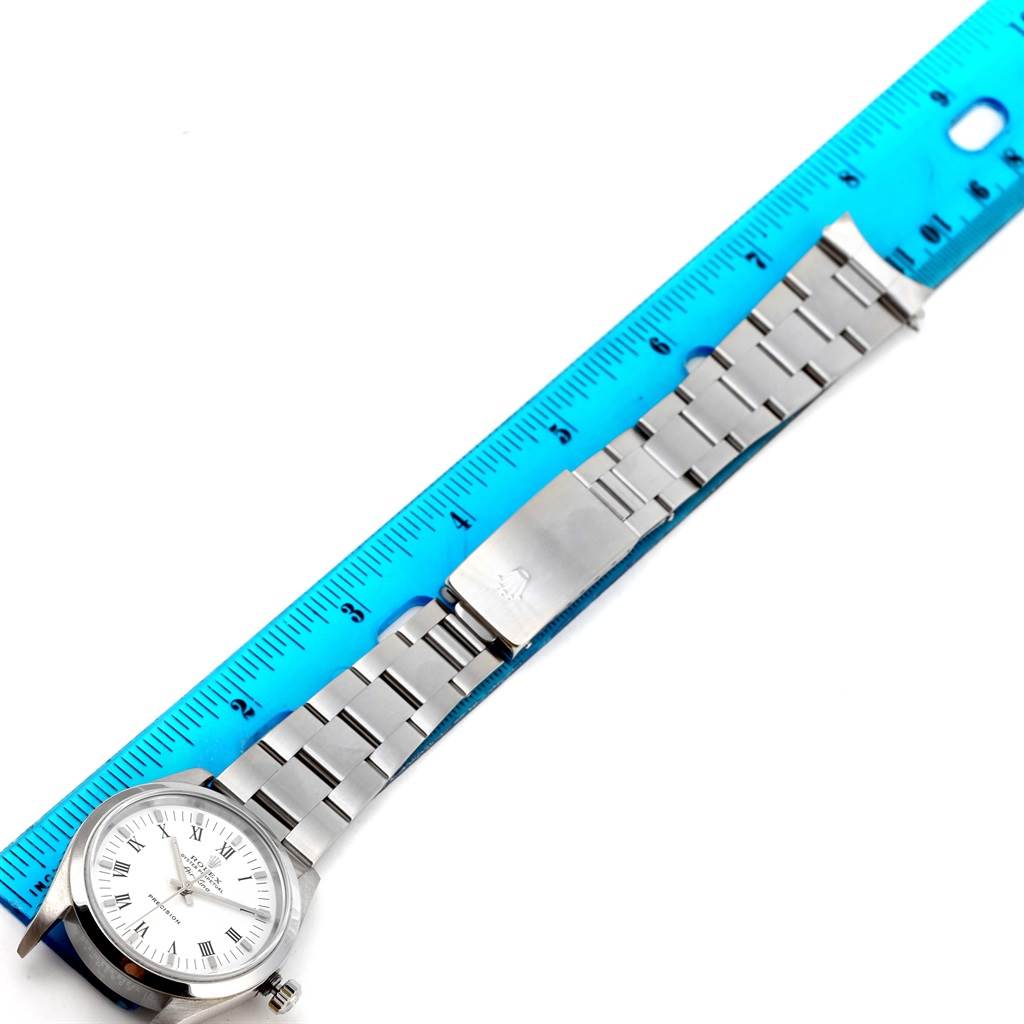 The image shows a Rolex Air-King 14000 Men's Stainless Steel White Dial 14000 Men's Stainless Steel White Dial watch laid flat, alongside a ruler for measurement, displaying the face and metal bracelet.