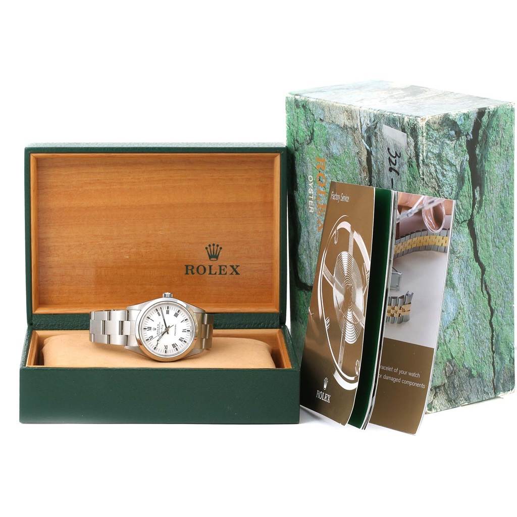 The Rolex Air-King 14000 Men's Stainless Steel White Dial 14000 Men's Stainless Steel White Dial watch is displayed inside its open box, alongside brochures and the outer packaging.