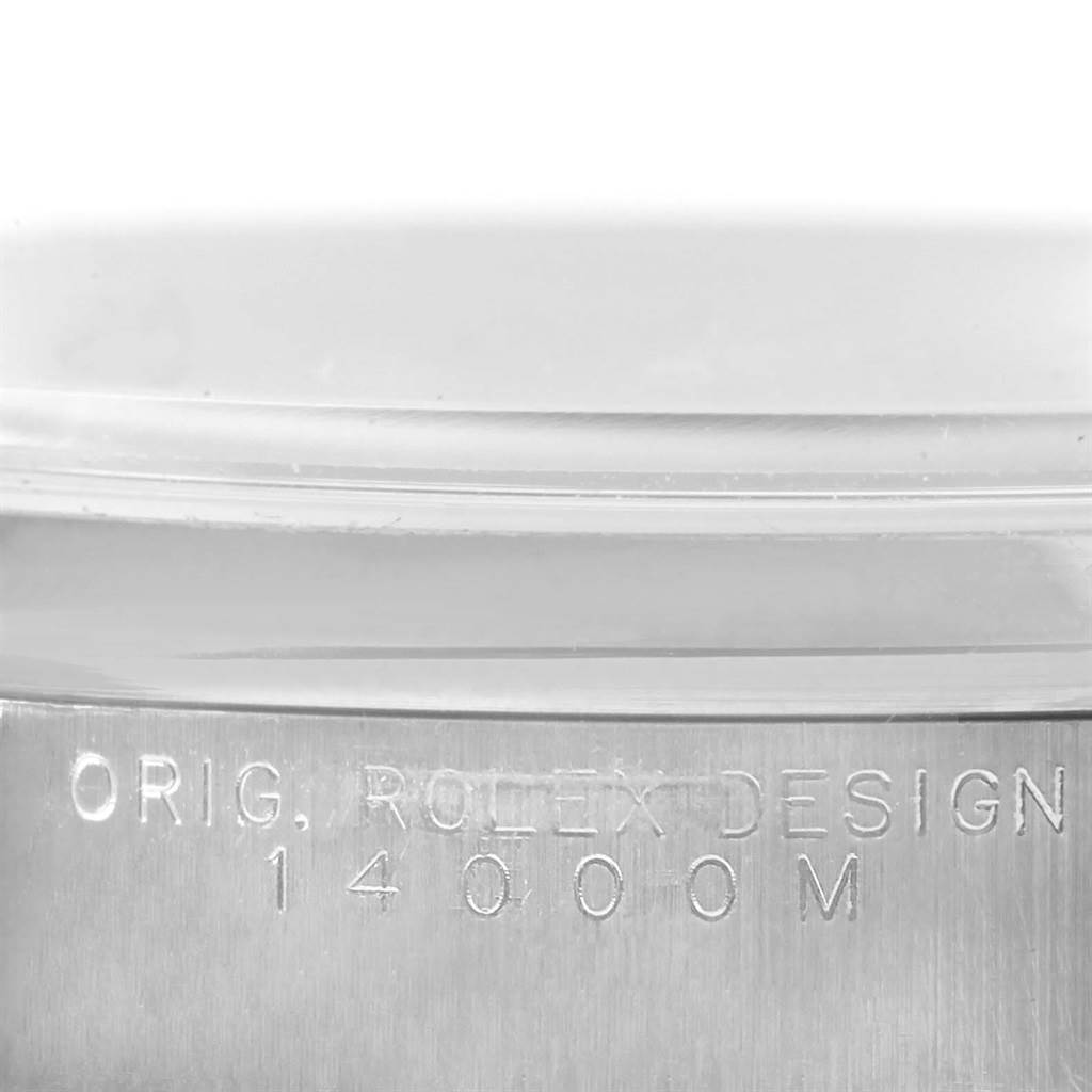 The image shows a close-up of the Rolex Air-King 14000 Men's Stainless Steel Blue Dial 14000 Men's Stainless Steel Blue Dial model's caseback edge, featuring the engraving "ORIG. ROLEX DESIGN 14000M."