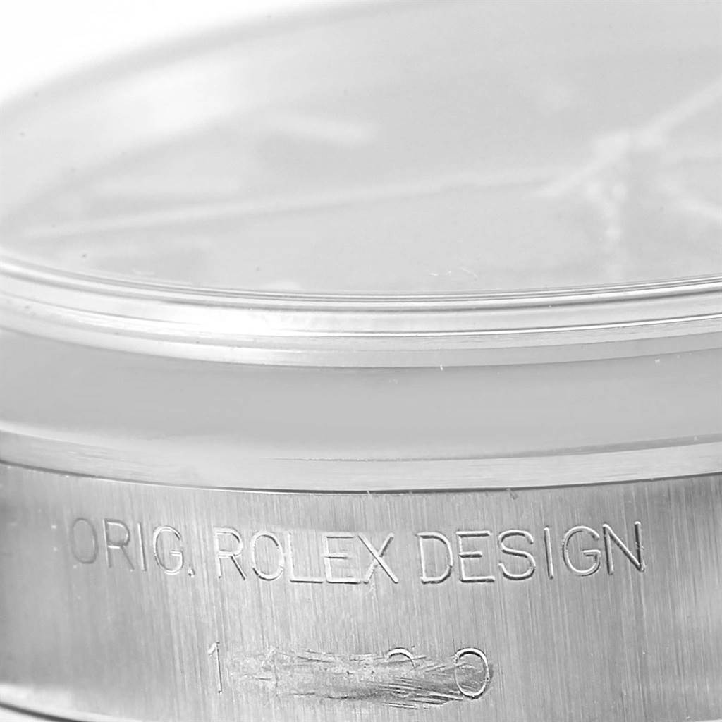 This image shows the case side of an Air-King Rolex watch, highlighting its "ORIG. ROLEX DESIGN" engraving.