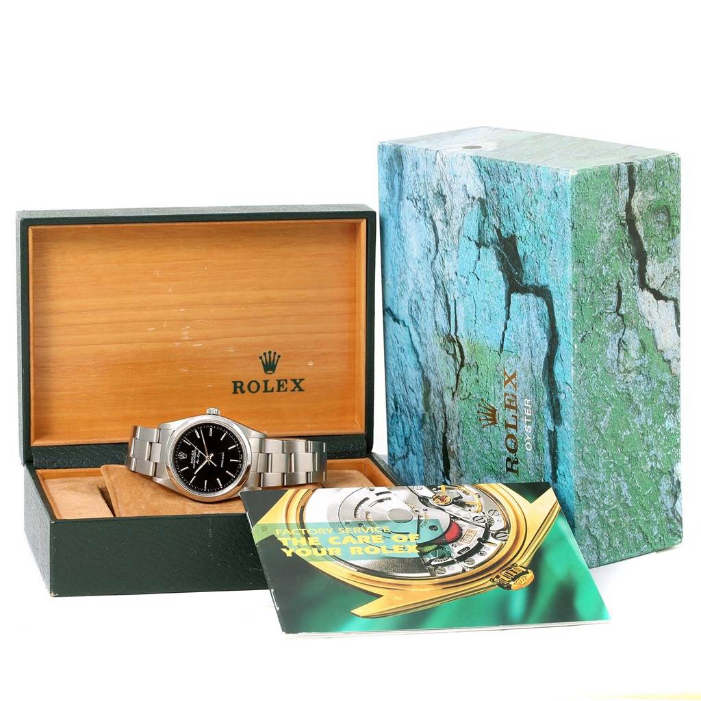 The image shows a Rolex Air-King 14000 Men's Stainless Steel Black Dial 14000 Men's Stainless Steel Black Dial watch in its open box, with the box cover and a booklet nearby.