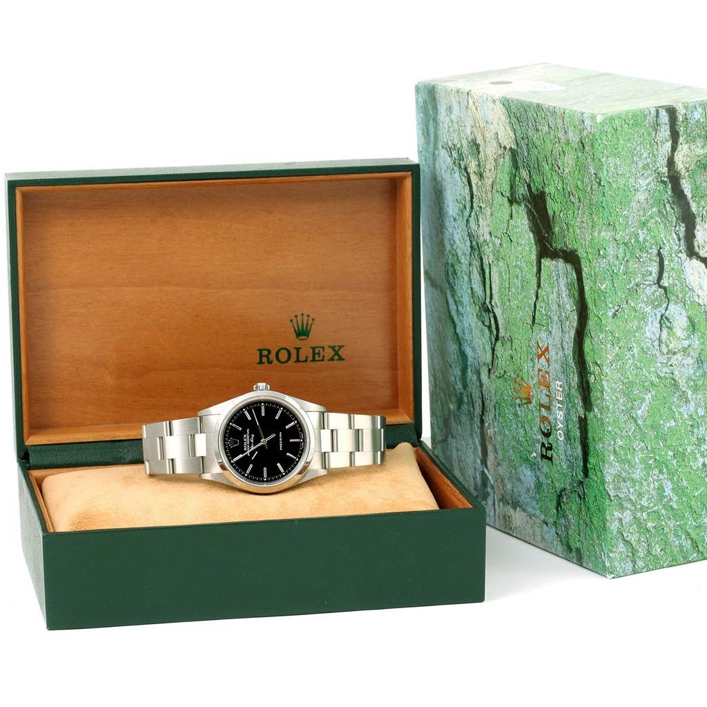 The Rolex Air-King 14000 Men's Stainless Steel Black Dial 14000 Men's Stainless Steel Black Dial watch is shown in its open green and wooden branded box at a frontal angle.