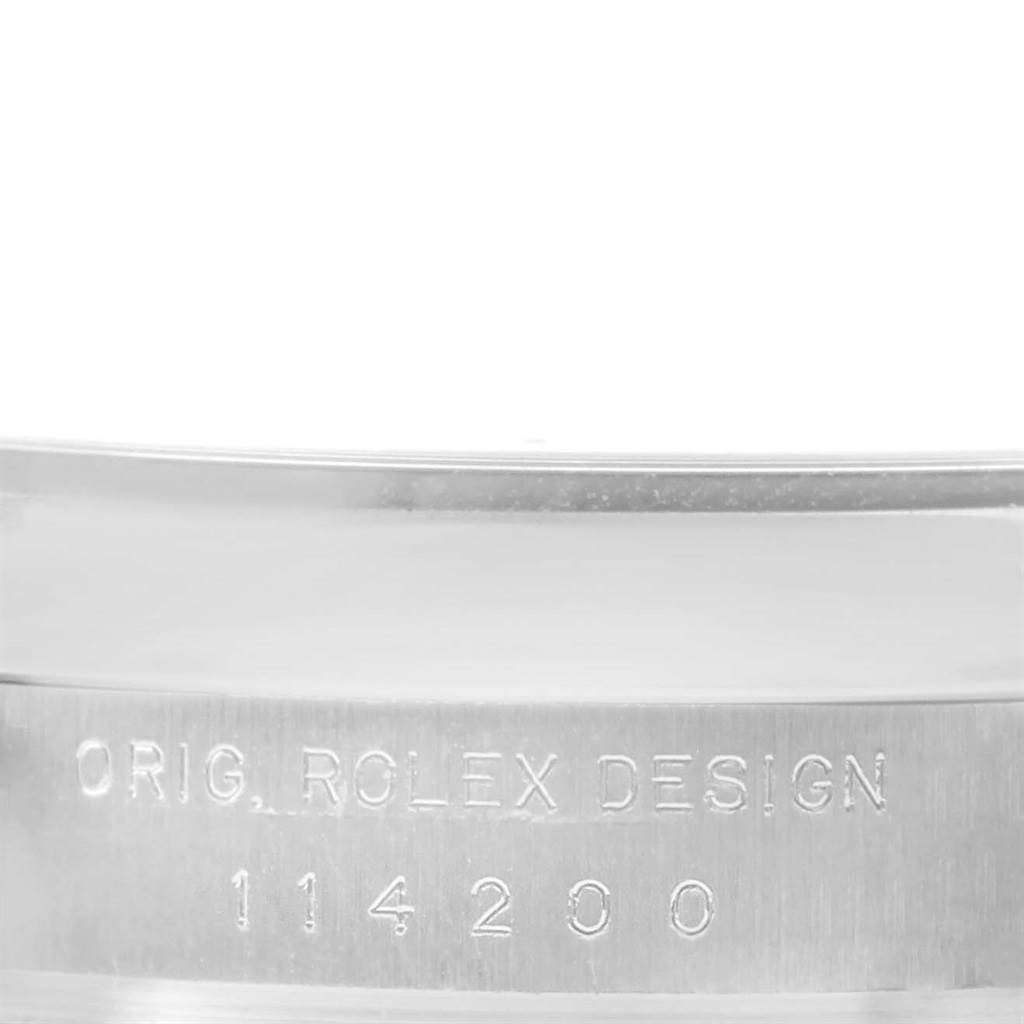 This image shows a close-up of the case side of a Rolex Air-King 114200 Men's Stainless Steel Blue Dial 114200 Men's Stainless Steel Blue Dial watch, highlighting the engraved model number '114200.'