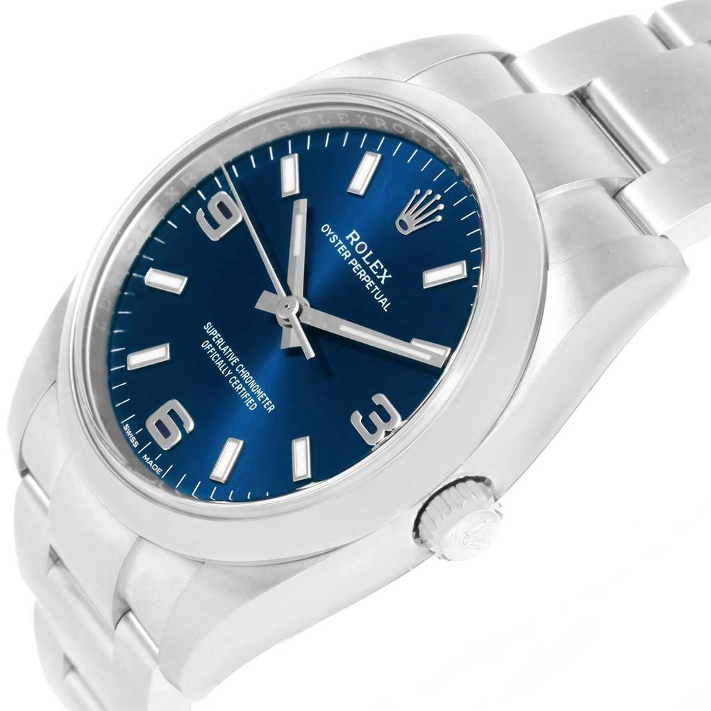 The image shows a Rolex Air-King 114200 Men's Stainless Steel Blue Dial 114200 Men's Stainless Steel Blue Dial watch at a three-quarter angle, highlighting the blue dial, bezel, crown, and part of the bracelet.
