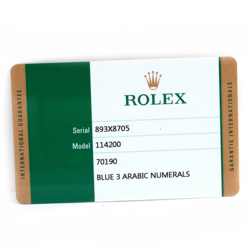 This image shows an international guarantee card for the Rolex Air-King 114200 Men's Stainless Steel Blue Dial 114200 Men's Stainless Steel Blue Dial model, displaying the serial number and model number.