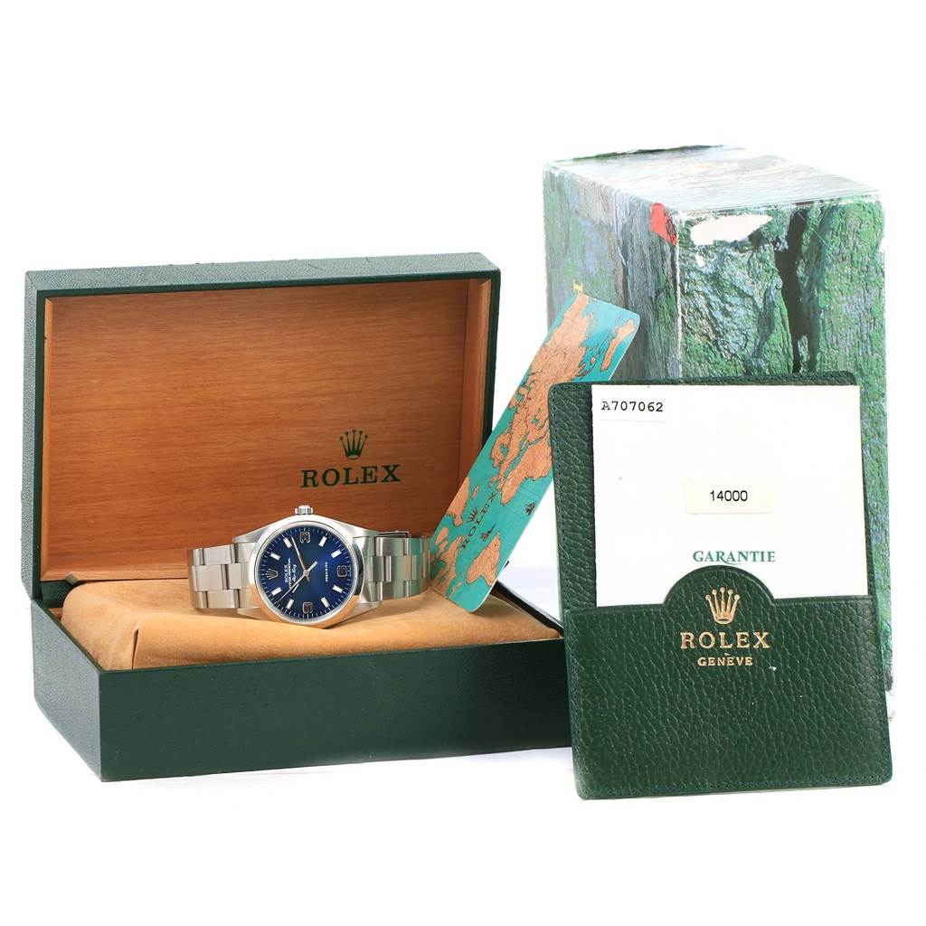 The image shows a Rolex Air-King 14000 Men's Stainless Steel Blue Dial 14000 Men's Stainless Steel Blue Dial watch, its green box, warranty card, and original packaging, viewed from a slightly angled front perspective.