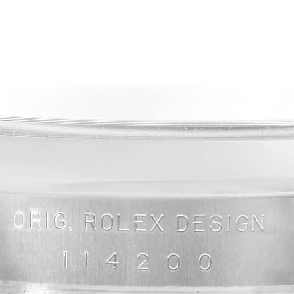 The image shows a close-up of the case side of a Rolex Air-King 114200 Men's Stainless Steel Blue Dial 114200 Men's Stainless Steel Blue Dial watch, highlighting the engraved model number.