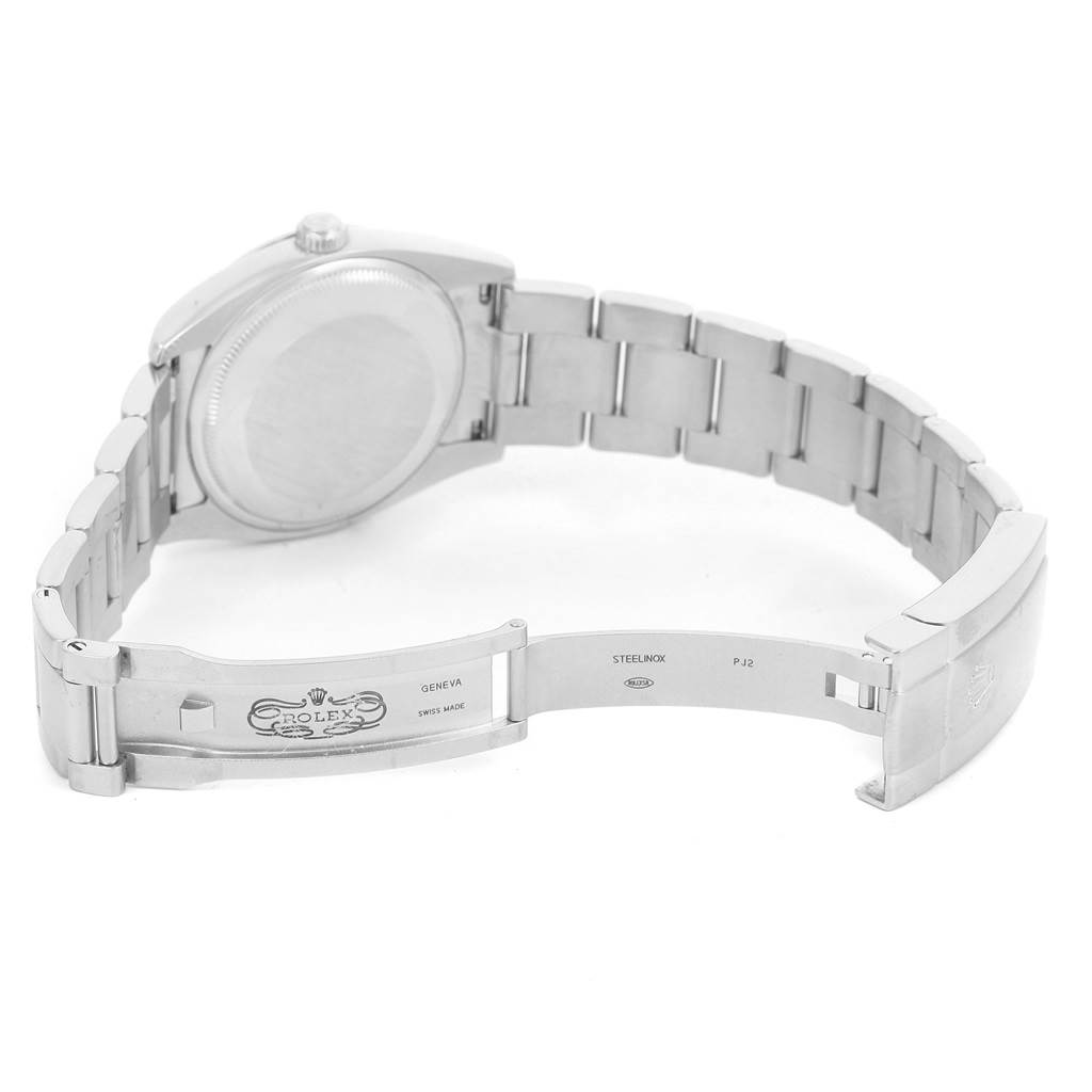 This image shows the clasp, open bracelet, and back case of a Rolex Air-King 114200 Men's Stainless Steel Blue Dial 114200 Men's Stainless Steel Blue Dial watch from a top-down angle.