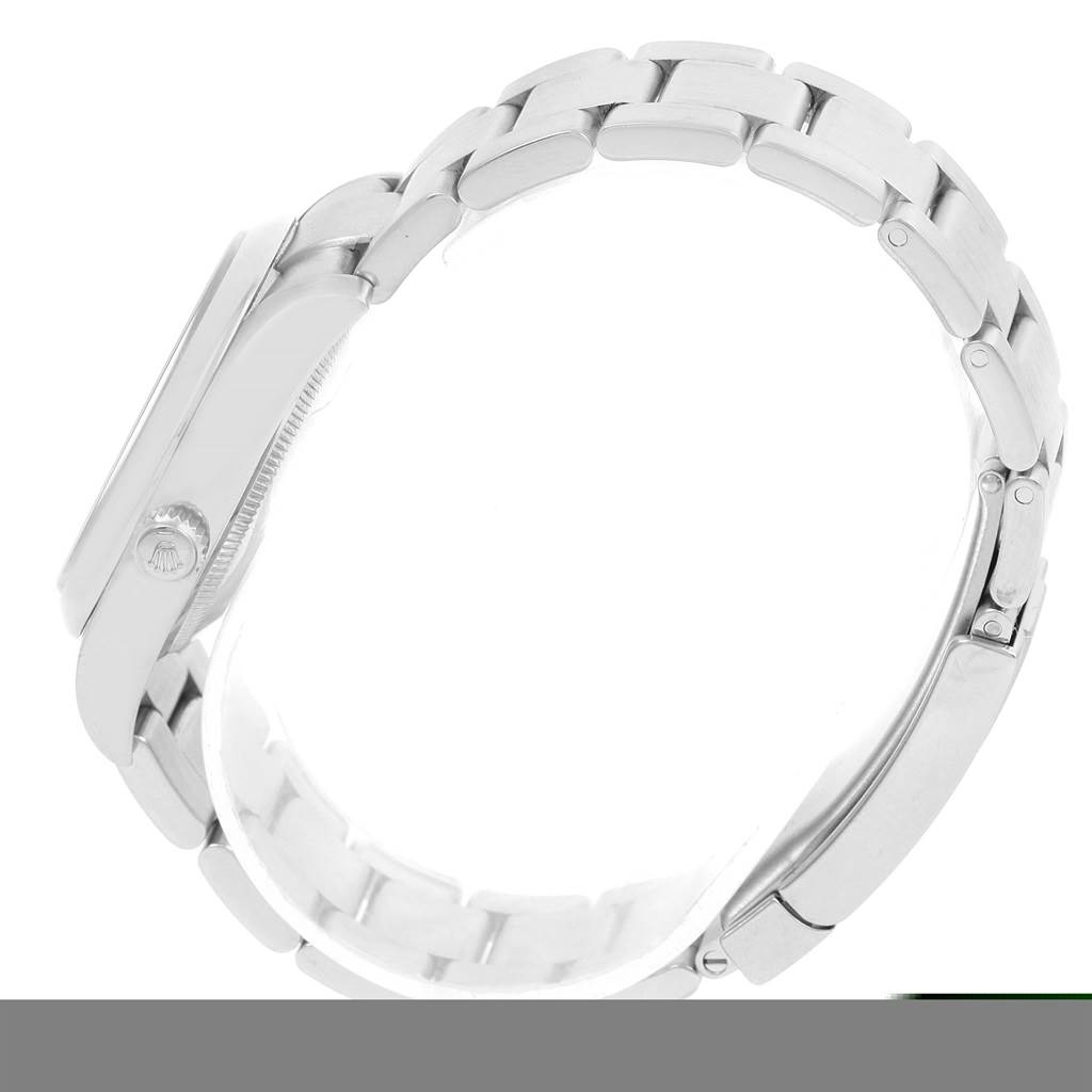 The image shows a side view of a Rolex Air-King 114200 Men's Stainless Steel Blue Dial 114200 Men's Stainless Steel Blue Dial watch, highlighting its metal bracelet and crown.