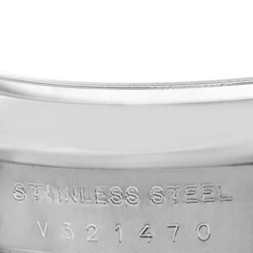 This image shows a close-up of the stainless steel case with serial number engraving on a Rolex Air-King 114200BLASO Men's Stainless Steel Blue Dial 114200BLASO Men's Stainless Steel Blue Dial watch.