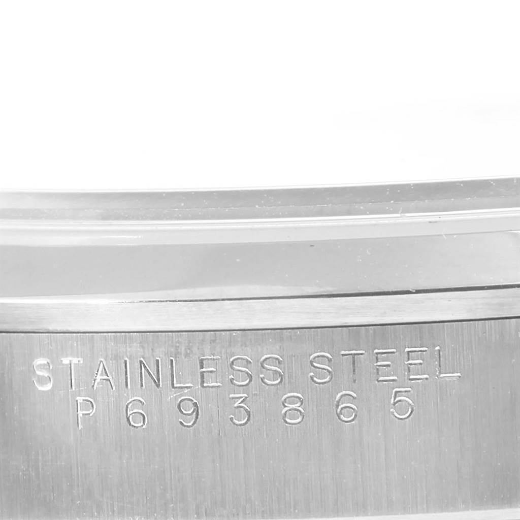 This close-up angle of the Rolex Air-King 14000 Men's Stainless Steel Blue Dial 14000 Men's Stainless Steel Blue Dial watch shows the stainless steel engraving with the serial number "P693865".