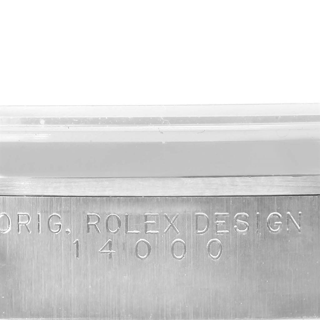 The image shows a close-up view of the side of a Rolex Air-King 14000 Men's Stainless Steel Blue Dial 14000 Men's Stainless Steel Blue Dial watch, featuring the engraved text "ORIG ROLEX DESIGN 14000".