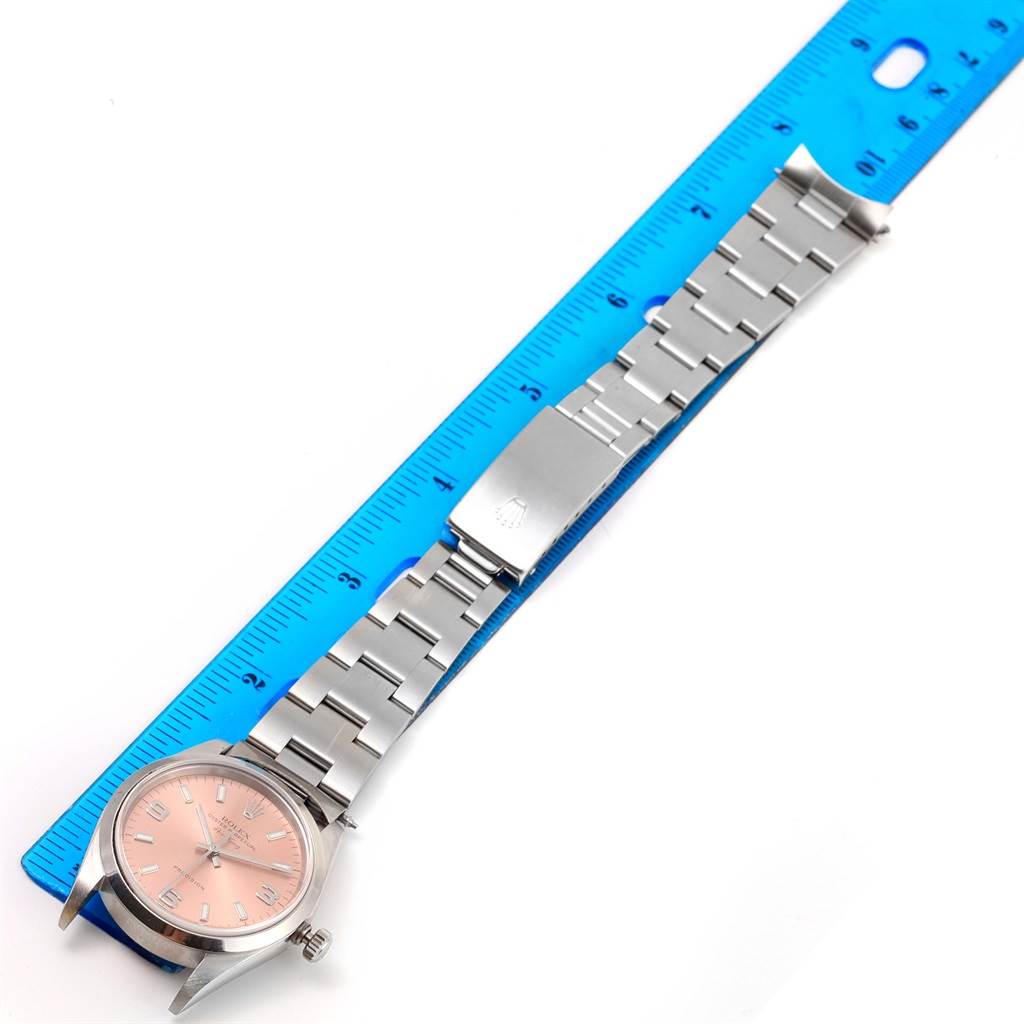 The image shows a Rolex Air-King 14000 Men's Stainless Steel Pink Dial 14000 Men's Stainless Steel Pink Dial watch with a full view of the face, bracelet, and clasp, aligned next to a blue ruler.