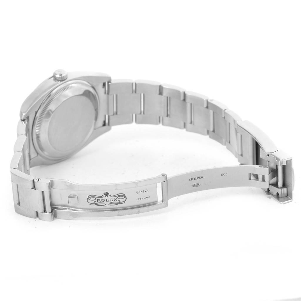 The image shows the Rolex Air-King 114200 Men's Stainless Steel Silver Dial 114200 Men's Stainless Steel Silver Dial watch partially open, displaying the bracelet and clasp from a rear angle.