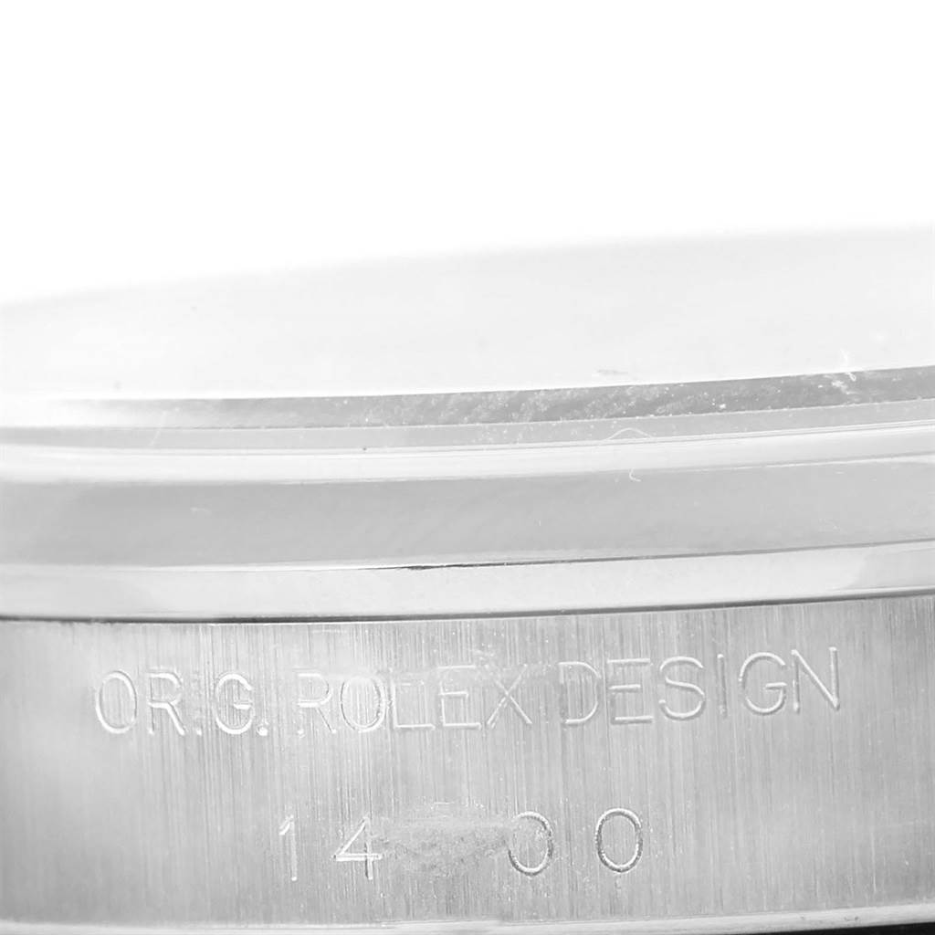 This image shows the engraved side of the stainless steel case of a Rolex Air-King 14000 Men's Stainless Steel Silver Dial 14000 Men's Stainless Steel Silver Dial watch.