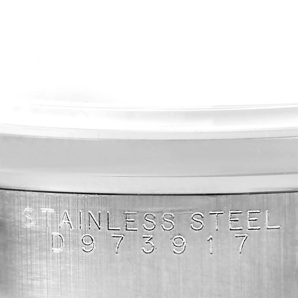 This image shows a close-up of the stainless steel case back of a Rolex Air-King 14000 Men's Stainless Steel Black Dial 14000 Men's Stainless Steel Black Dial watch, displaying its serial number.