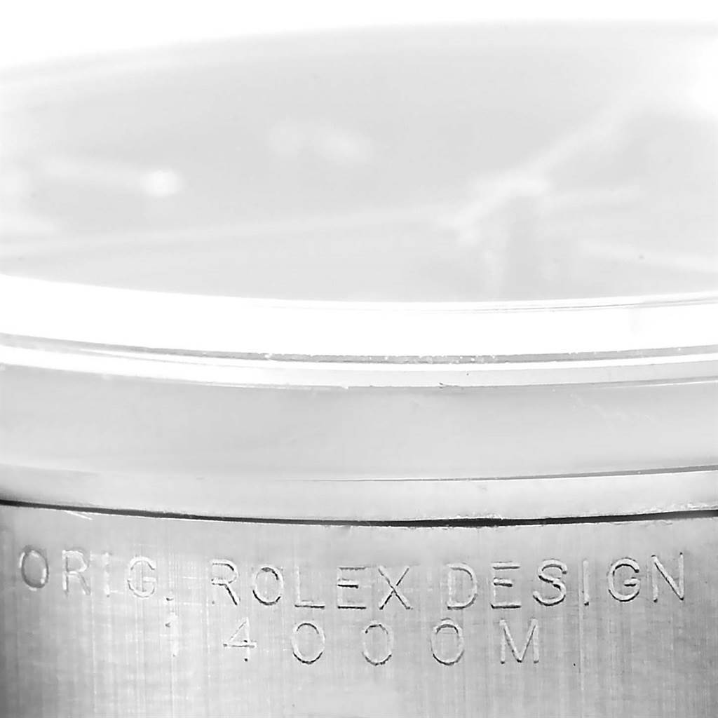 This image shows a close-up of the casing and engravings on a Rolex Air-King 14000 Men's Stainless Steel Black Dial 14000 Men's Stainless Steel Black Dial watch, specifically focusing on the model number 14000M.