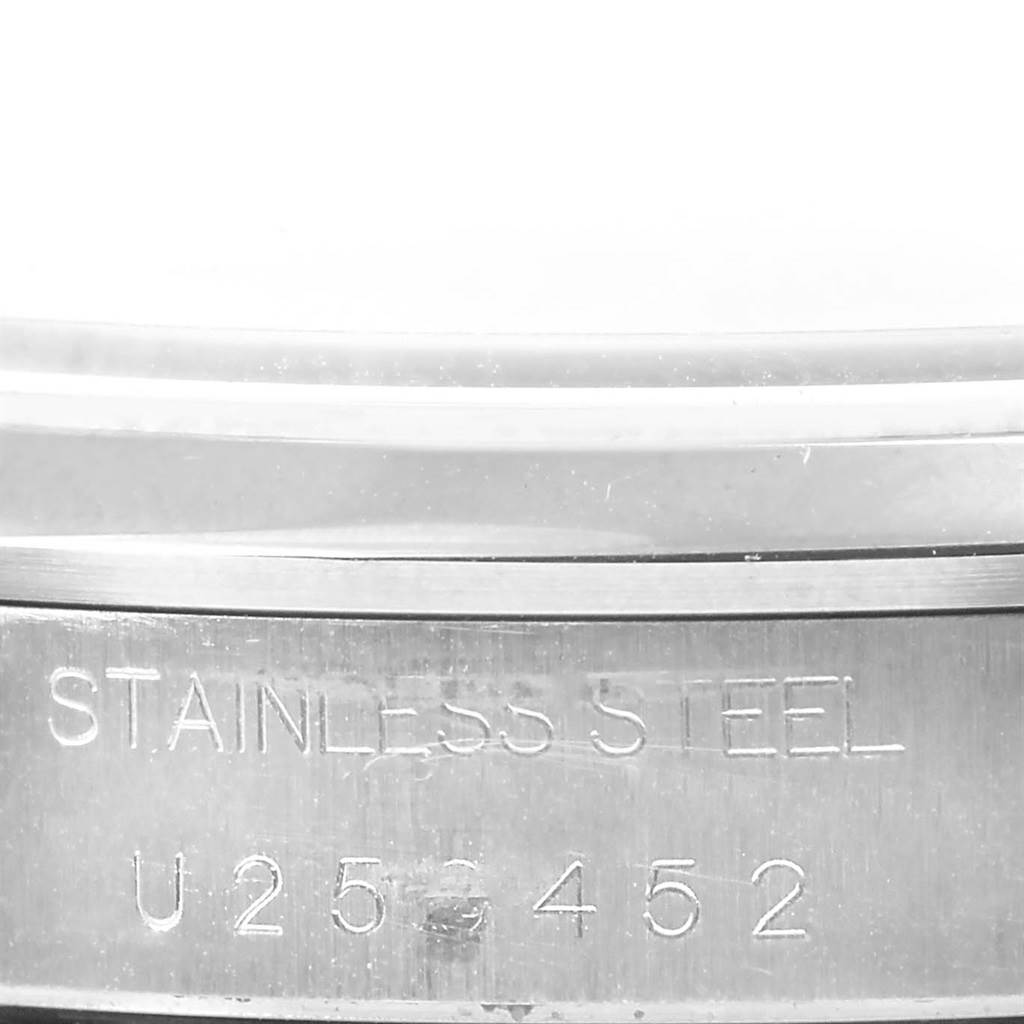 This close-up image shows the stainless steel casing with serial engraving on a Rolex Air-King 14000 Men's Stainless Steel Silver Dial 14000 Men's Stainless Steel Silver Dial watch.