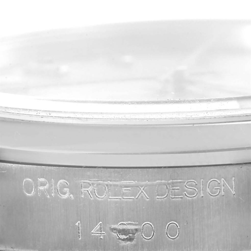 The image shows a close-up of the side of the Rolex Air-King 14000 Men's Stainless Steel Silver Dial 14000 Men's Stainless Steel Silver Dial watch case, revealing the "ORIG. ROLEX DESIGN" engraving and model number "14000".