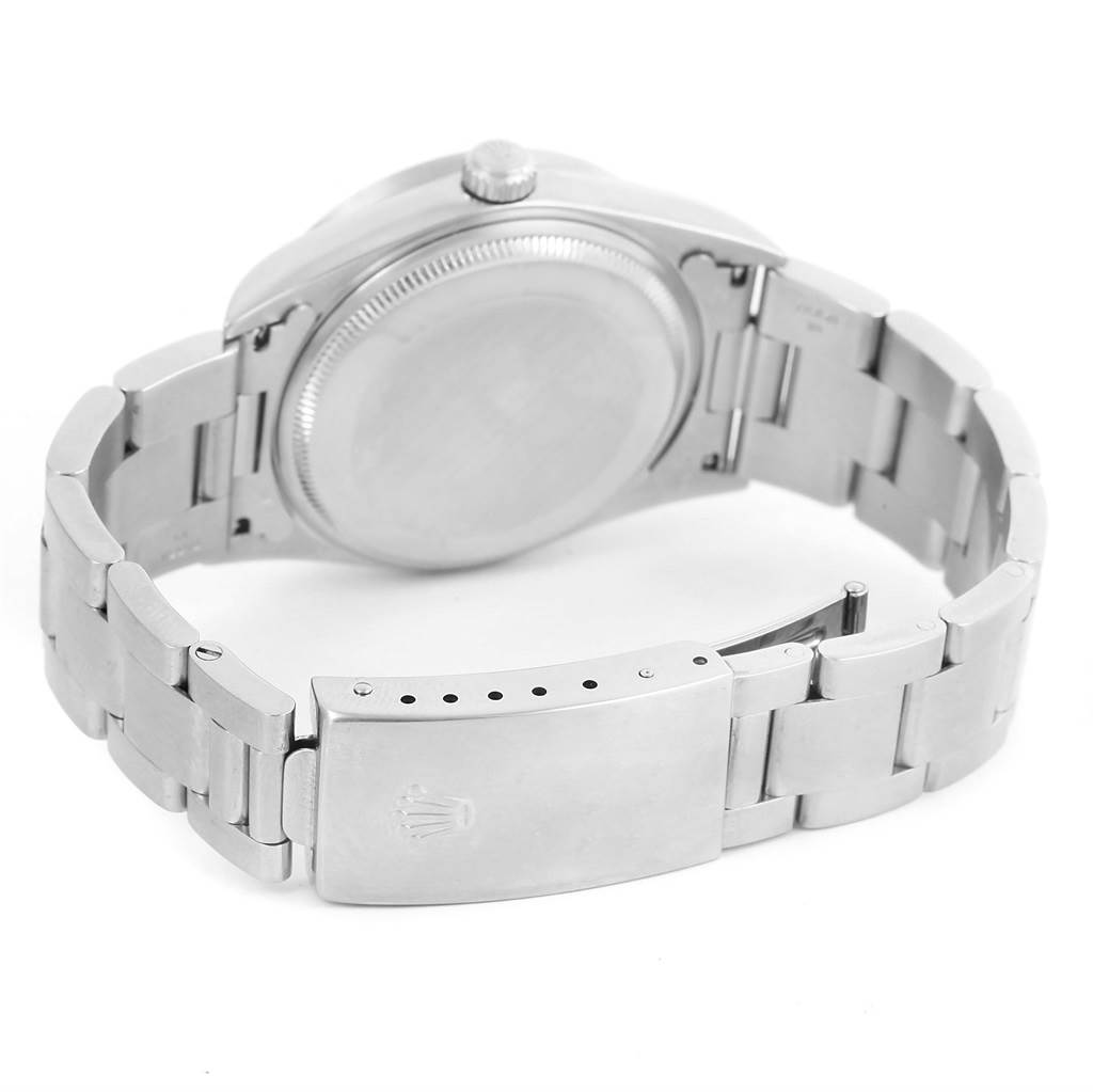 The image shows the back of a Rolex Air-King 14010 Men's Stainless Steel Black Dial 14010 Men's Stainless Steel Black Dial watch, featuring the case back and bracelet with the clasp partially open.