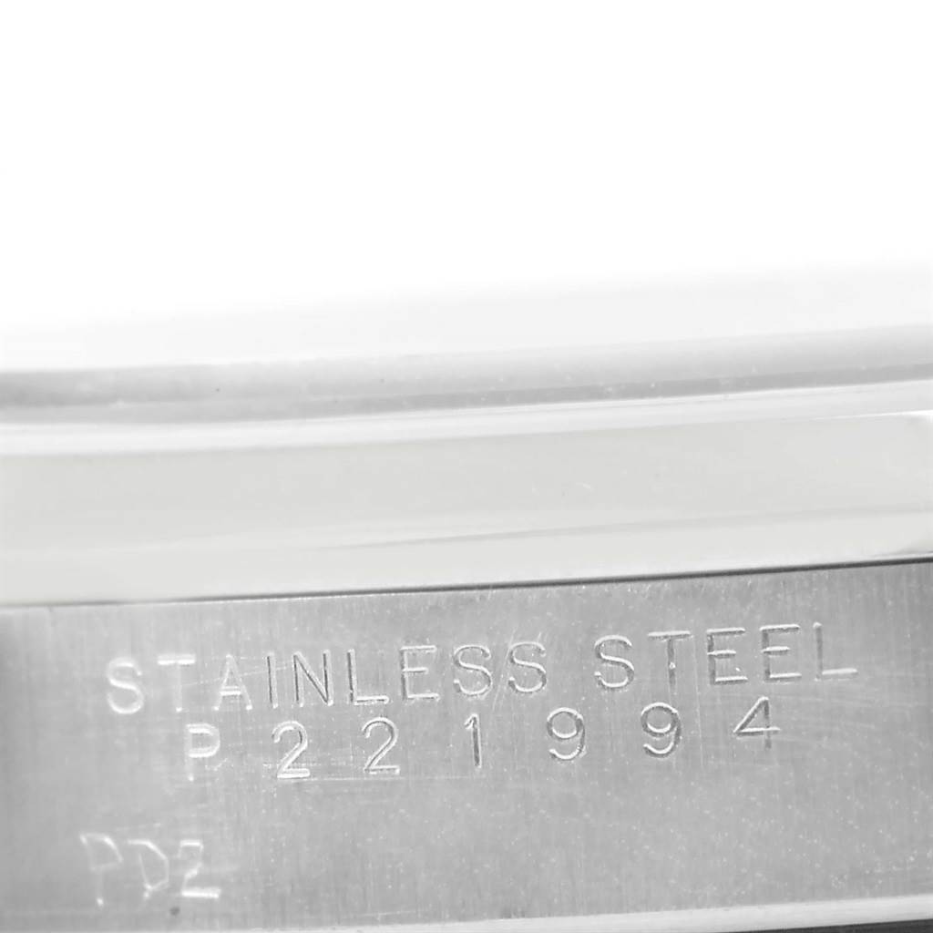 This image shows a close-up of the stainless steel band and serial number of a Rolex Air-King 14000 Men's Stainless Steel Pink Dial 14000 Men's Stainless Steel Pink Dial watch.