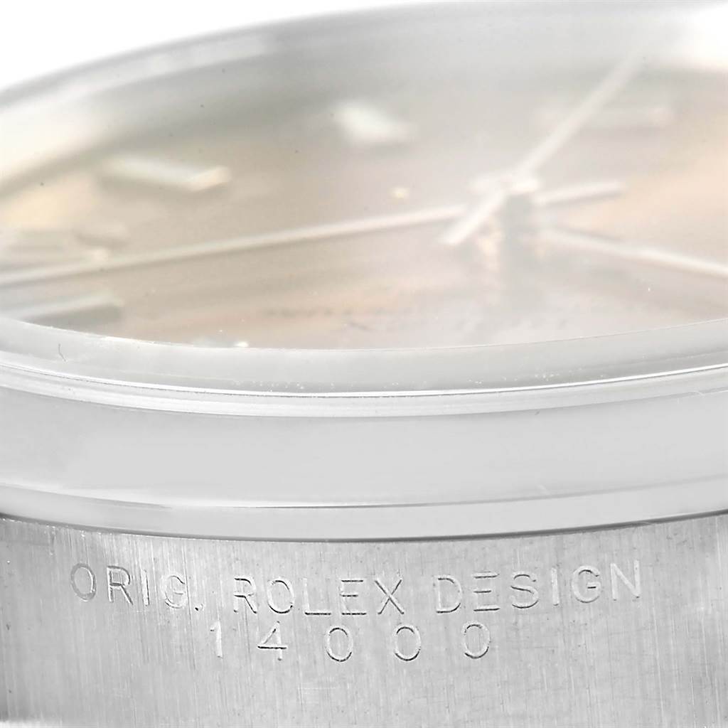 This image shows a close-up side view of the Rolex Air-King 14000 Men's Stainless Steel Pink Dial 14000 Men's Stainless Steel Pink Dial model, highlighting the bezel and engraved model number "14000".