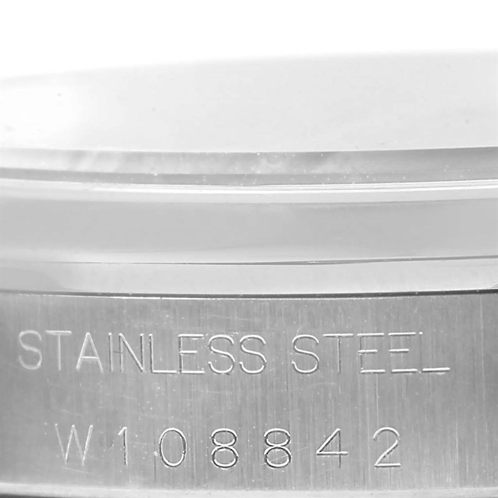 The image shows a close-up of the side of a Rolex Air-King 14000 Men's Stainless Steel Black Dial 14000 Men's Stainless Steel Black Dial watch case, highlighting the "Stainless Steel" and serial number engravings.