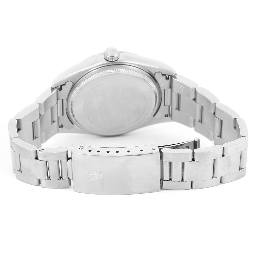 This image shows the Rolex Air-King 14000 Men's Stainless Steel Black Dial 14000 Men's Stainless Steel Black Dial watch from the back, highlighting the case back, crown, and stainless steel bracelet with the clasp open.