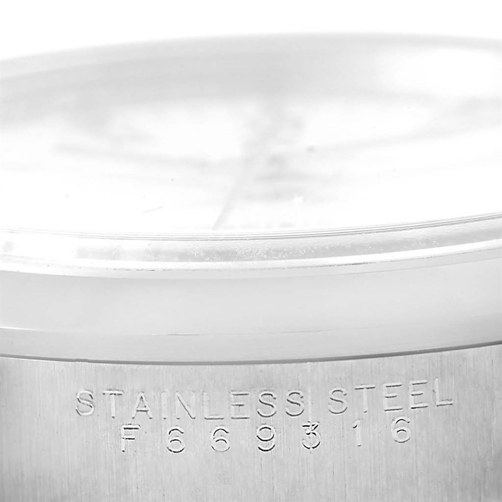 The image shows a partial side view of a Rolex Air-King 14000 Men's Stainless Steel White Dial 14000 Men's Stainless Steel White Dial watch, focusing on the stainless steel case with its serial number.