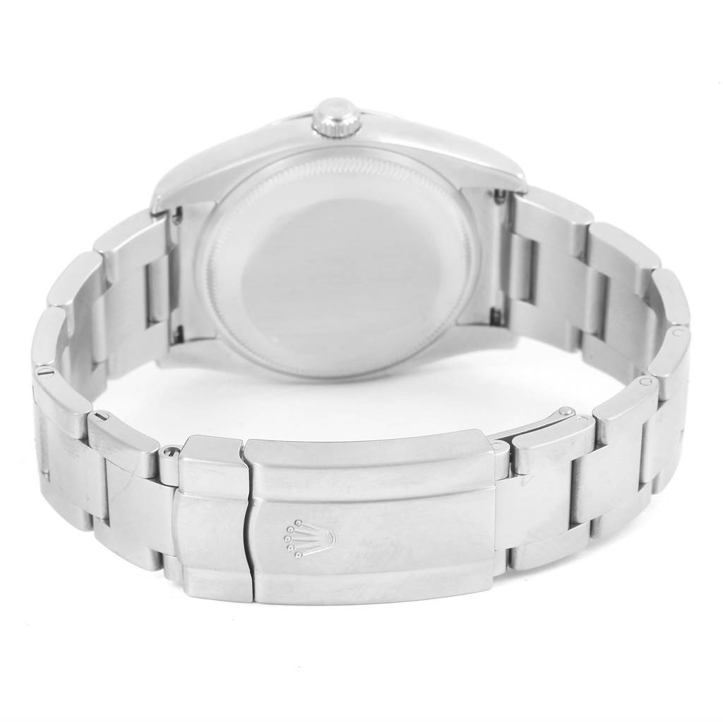 The image shows a rear view of the Rolex Air-King 114200 Men's Stainless Steel Grey Dial 114200 Men's Stainless Steel Grey Dial watch, highlighting its stainless steel case back and bracelet with the clasp.