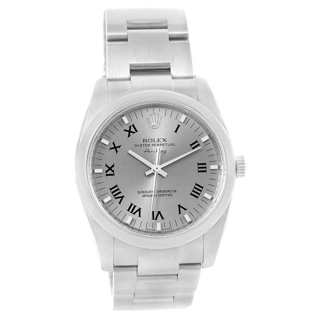The Rolex Air-King 114200 Men's Stainless Steel Grey Dial 114200 Men's Stainless Steel Grey Dial watch is shown from a front angle, highlighting its silver dial, Roman numerals, and metal bracelet.