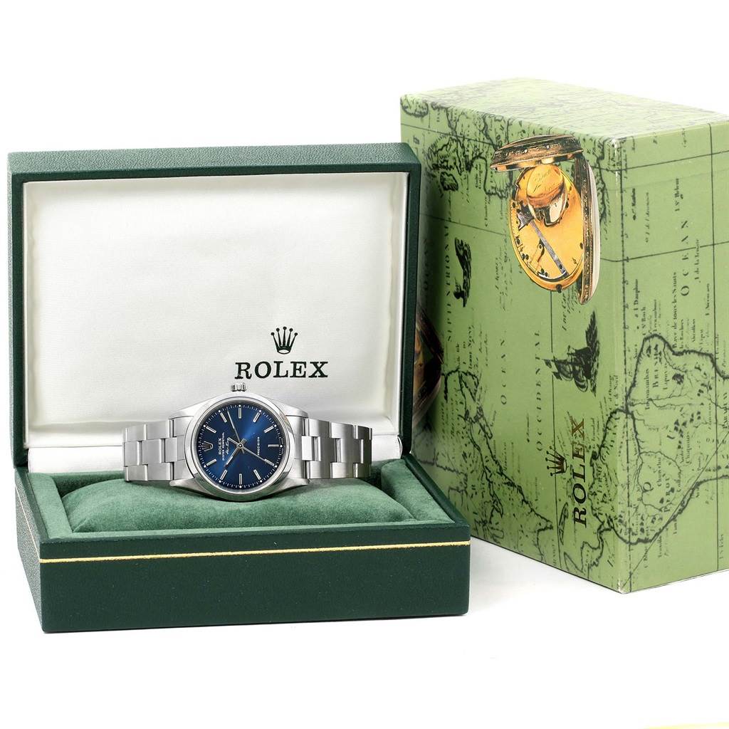 The Rolex Air-King 14000 Men's Stainless Steel Blue Dial 14000 Men's Stainless Steel Blue Dial watch is shown from the front, placed in an open green display box with the outer packaging visible.