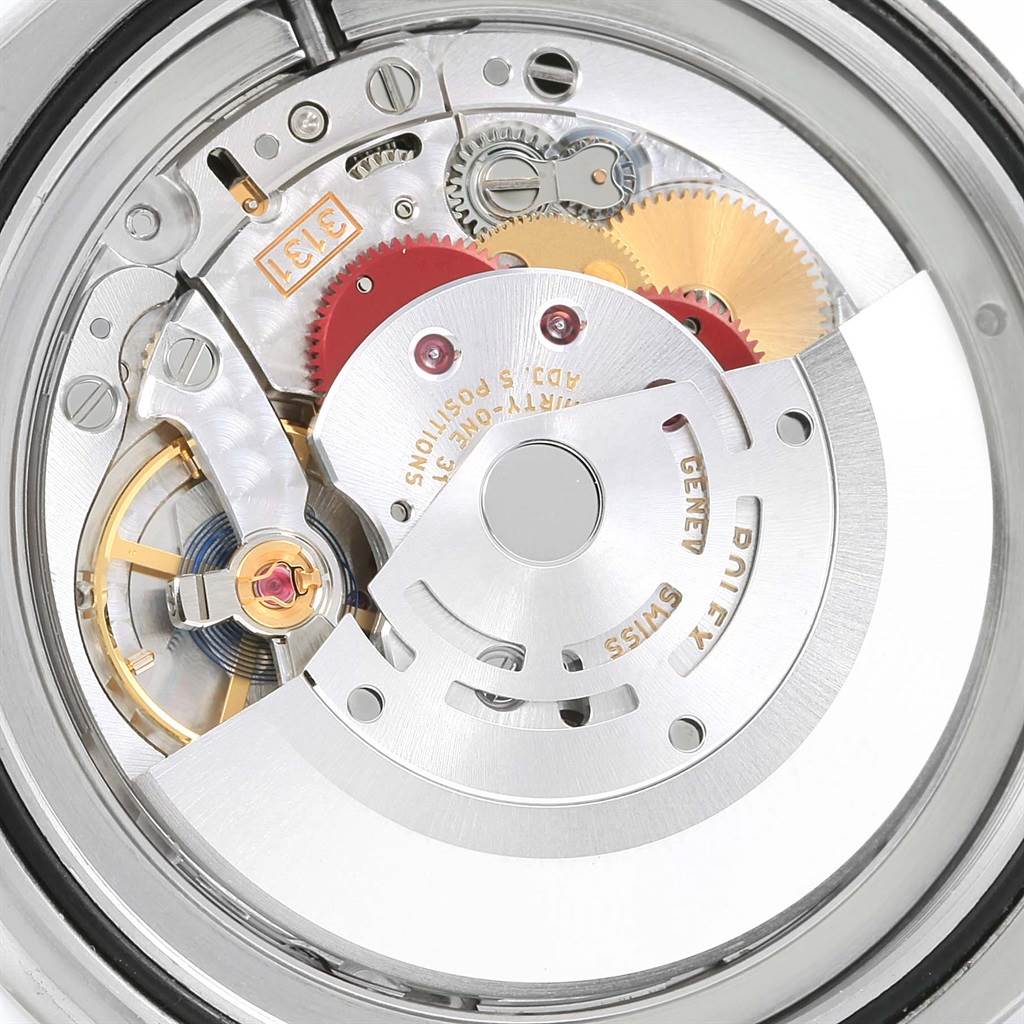 The image shows the internal mechanism of a Rolex Air-King 116900 Men's Stainless Steel Black Dial 116900 Men's Stainless Steel Black Dial watch, highlighting its gears and movement components.
