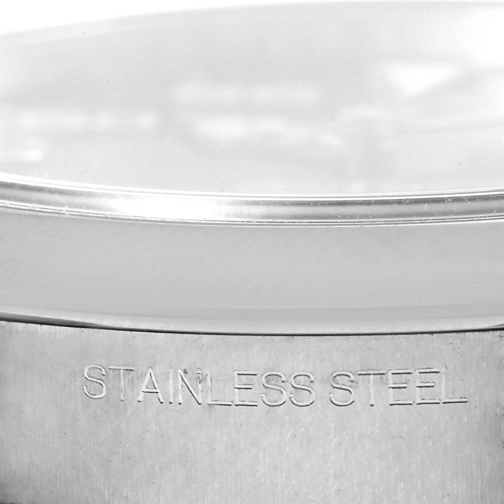 This image shows a close-up view of the stainless steel bezel and case of a Rolex Air-King 116900 Men's Stainless Steel Black Dial 116900 Men's Stainless Steel Black Dial watch.